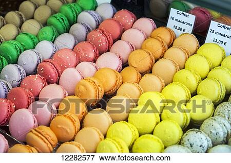 Close up of colourful macaroons in a bakeries display case; Dinan, Brittany, France View Large Photo Image Stock Photo - Close up of colourful macaroons in a bakeries display case; Dinan, Brittany, France. Fotosearch