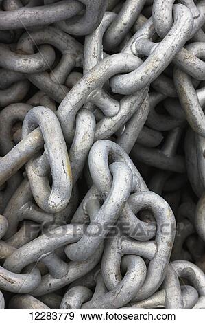 Close up of steel chain links in a pile, St. Paul Harbor, St. Paul Island, Southwestern Alaska, USA, summer View Large Photo Image Stock Photo - Close up of steel chain links in a pile, St. Paul Harbor, St. Paul Island, Southwestern Alaska, USA, summer. Fotosearch