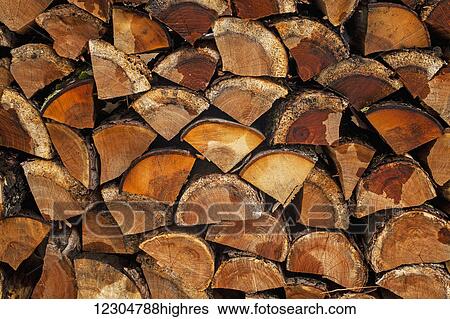 Stock Photograph - Close up of the ends of cut wood in a wood pile; Waterloo, Quebec, Canada. Fotosearch