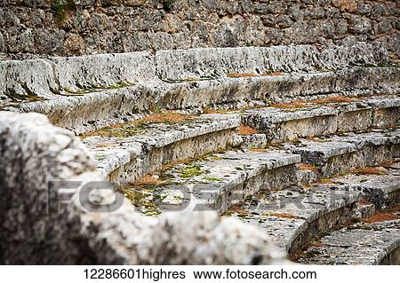Stock Photograph - Close up of the ruined seating at an ancient stadium and race track; Delphi, Greece. Fotosearch