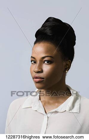 Close up portrait of an African Canadian woman against blue wall; Toronto, Ontario, Canada View Large Photo Image Stock Photograph - Close up portrait of an African Canadian woman against blue wall; Toronto, Ontario, Canada. Fotosearch