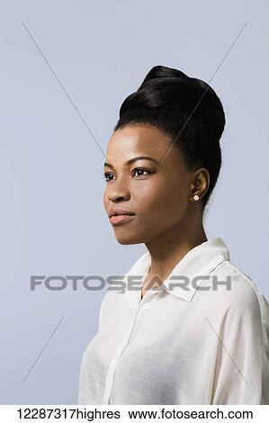 Close up portrait of an African Canadian woman against blue wall; Toronto, Ontario, Canada View Large Photo Image Stock Photograph - Close up portrait of an African Canadian woman against blue wall; Toronto, Ontario, Canada. Fotosearch
