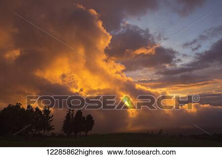 Clouds glowing orange at sunset; Kula, Maui, Hawaii, United States of America View Large Photo Image Stock Photograph - Clouds glowing orange at sunset; Kula, Maui, Hawaii, United States of America. Fotosearch