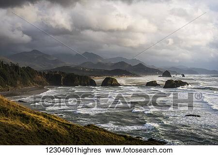 Stock Photograph - Clouds hang low over the Oregon Coast; Cannon Beach, Oregon, United States of America. Fotosearch