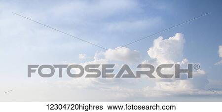 Stock Photograph - Clouds in a blue sky; Toronto, Ontario, Canada. Fotosearch