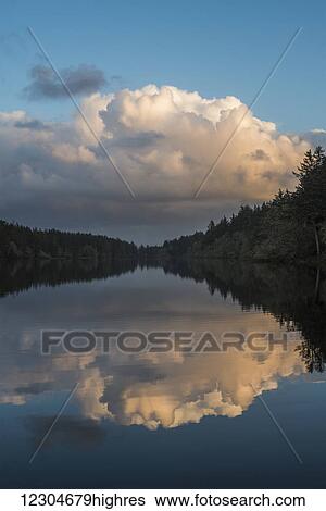 Clouds loom over Coffenbury Lake; Hammond, Oregon, United States of America View Large Photo Image Stock Photograph - Clouds loom over Coffenbury Lake; Hammond, Oregon, United States of America. Fotosearch