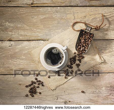 Coffee beans and a fresh cup of coffee; Toronto, Ontario, Canada View Large Photo Image Stock Photograph - Coffee beans and a fresh cup of coffee; Toronto, Ontario, Canada. Fotosearch