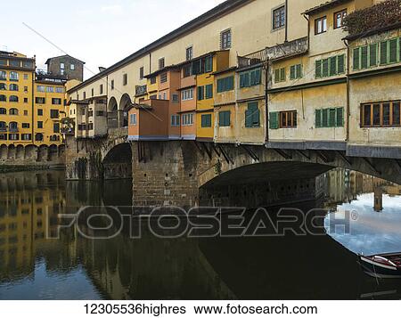 Stock Photograph - Colourful buildings on Ponte Vecchio over the Arno River; Florence, Toscana, Italy. Fotosearch