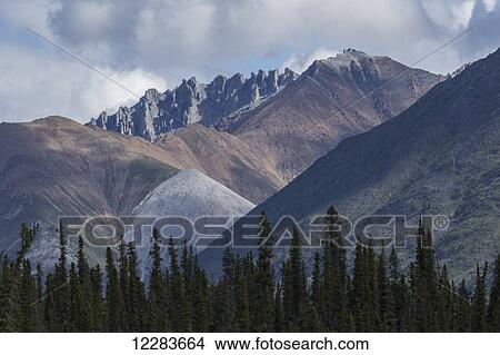 Colourful mountains along the Wind River in the Peel Watershed; Yukon, Canada View Large Photo Image Picture - Colourful mountains along the Wind River in the Peel Watershed; Yukon, Canada. Fotosearch