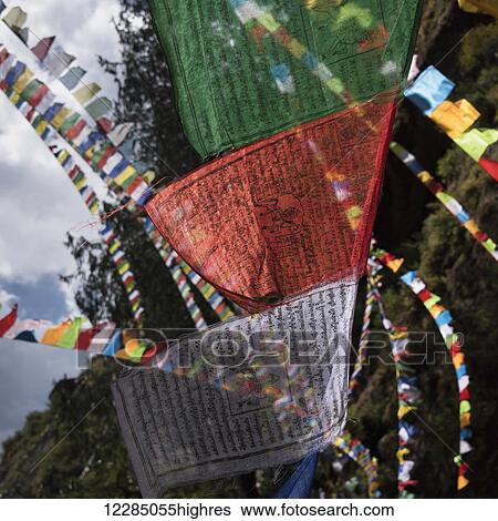 Stock Photograph - Colourful prayer flags; Paro, Bhutan. Fotosearch