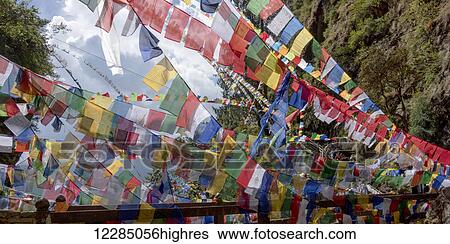 Stock Photograph - Colourful prayer flags; Paro, Bhutan. Fotosearch