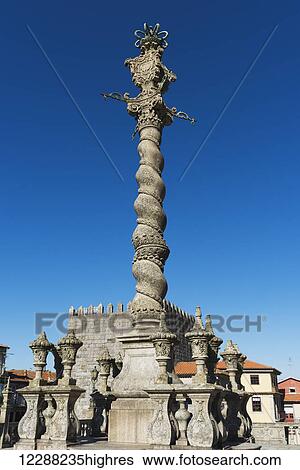 Stock Photograph - Column monument against a blue sky; Oporto, Portugal. Fotosearch