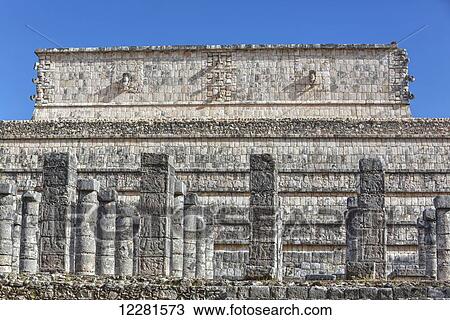 Stock Image - Columns adorned with carved animal deities, Group of a Thousand Columns, Chichen Itza; Yucatan, Mexico. Fotosearch
