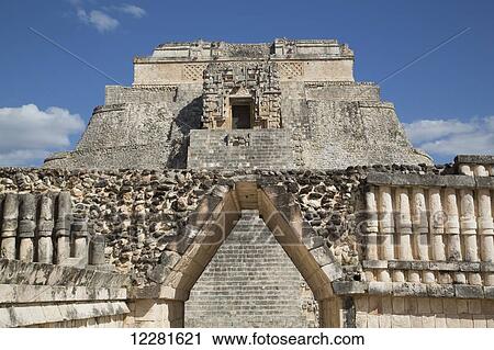 Corbelled Arch (foreground), Pyramid of the Magician (background), Uxmal Mayan archaeological site; Yucatan, Mexico View Large Photo Image Stock Image - Corbelled Arch (foreground), Pyramid of the Magician (background), Uxmal Mayan archaeological site; Yucatan, Mexico. Fotosearch