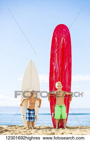 Cute Young Boys With Surfboards on the Beach in Hawaii. Going Surfing. View Large Photo Image Stock Photograph - Cute Young Boys With Surfboards on the Beach in Hawaii. Going Surfing.. Fotosearch