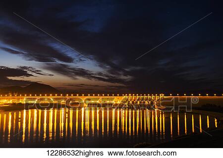 Dam over the Euphrates river lit up at nighttime; Turkey View Large Photo Image Stock Photograph - Dam over the Euphrates river lit up at nighttime; Turkey. Fotosearch