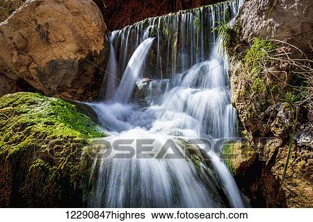 David and his men stayed in Ein Gedi and certainly enjoyed the fresh water falling from the Desert plateau above. There are several waterfalls of differing sizes that make there way down to the Dead Sea below; Ein Gedi, Israel View Large Photo Image Stock Photograph - David and his men stayed in Ein Gedi and certainly enjoyed the fresh water falling from the Desert plateau above. There are several waterfalls of differing sizes that make there way down to the Dead Sea below; Ein Gedi, Israel. Fotosearch