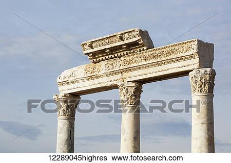 Stock Photograph - Decorative stone carved columns and lintel at a biblical site; Laodicea, Turkey. Fotosearch