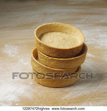 Dessert cups in a pile on a floured surface; Toronto, Ontario, Canada View Large Photo Image Stock Photograph - Dessert cups in a pile on a floured surface; Toronto, Ontario, Canada. Fotosearch