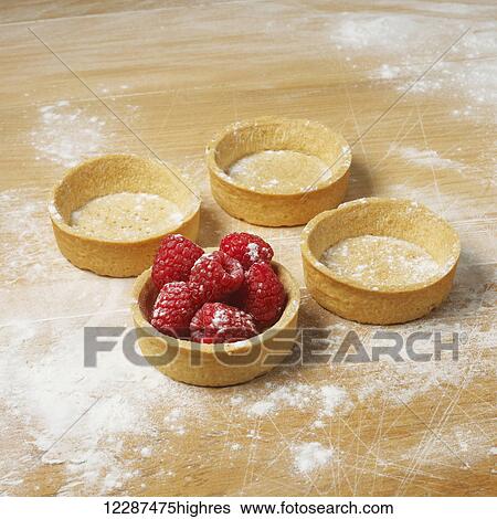Dessert cups on a floured surface with raspberries in one; Toronto, Ontario, Canada View Large Photo Image Stock Photograph - Dessert cups on a floured surface with raspberries in one; Toronto, Ontario, Canada. Fotosearch