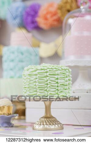 Stock Photograph - Dessert table set up for celebration or party filled with cakes, cupcakes, and sweets; Toronto, Ontario, Canada. Fotosearch