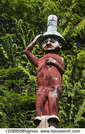 Stock Photograph - Detail of a human figure carved into a totem pole, Totem Bight State Historical Park, Ketchikan, Southeast Alaska, USA, Spring. Fotosearch