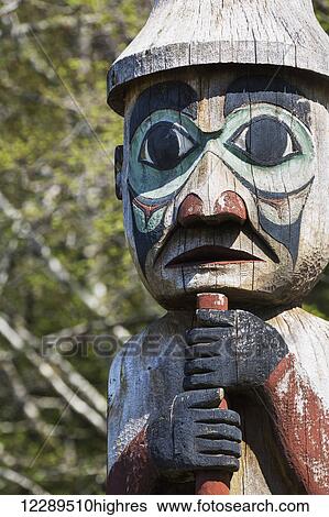 Stock Photograph - Detail of a human figure carved into a totem pole, Totem Bight State Historical Park, Ketchikan, Southeast Alaska, USA, Spring. Fotosearch