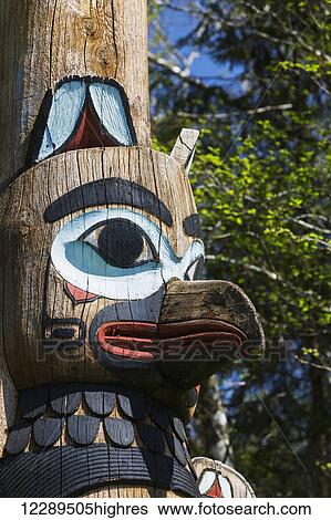 Detail of a raven figure carved into a totem pole, Totem Bight State Historical Park; Ketchikan, Alaska, United States of America View Large Photo Image Stock Photograph - Detail of a raven figure carved into a totem pole, Totem Bight State Historical Park; Ketchikan, Alaska, United States of America. Fotosearch
