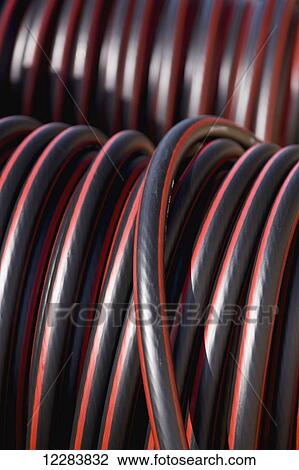Stock Image - Detail of large diameter cable coiled on wooden spools at an electrical power plant, Sand Point, Southwestern Alaska, USA. Fotosearch