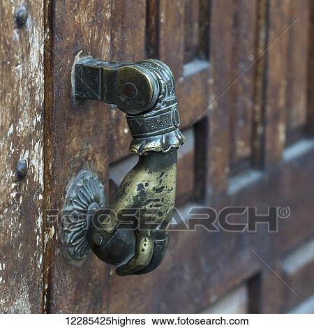 Door handle designed as a hand on a doorknob; San Miguel de Allende, Guanajuato, Mexico View Large Photo Image Stock Photograph - Door handle designed as a hand on a doorknob; San Miguel de Allende, Guanajuato, Mexico. Fotosearch