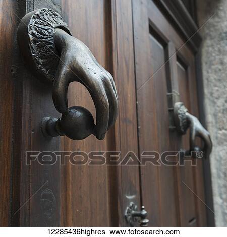 Stock Photograph - Door handle designed with a human hand on a knob; Guanajuato, Mexico. Fotosearch
