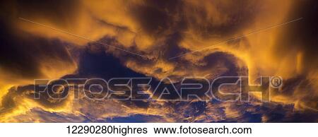Dramatic colourful clouds at sunset with interesting formations and some blue sky; Calgary, Alberta, Canada View Large Photo Image Stock Photograph - Dramatic colourful clouds at sunset with interesting formations and some blue sky; Calgary, Alberta, Canada. Fotosearch