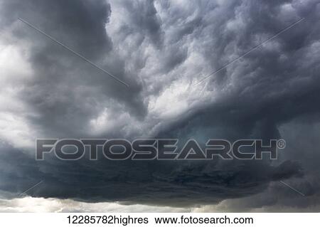 Stock Photograph - Dramatic dark storm clouds; Calgary, Alberta, Canada. Fotosearch