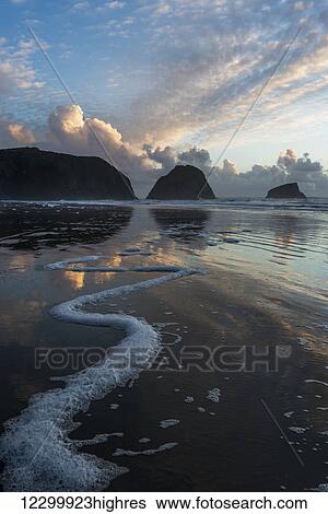 Dusk approaches on Crescent Beach; Cannon Beach, Oregon, United States of America View Large Photo Image Stock Photograph - Dusk approaches on Crescent Beach; Cannon Beach, Oregon, United States of America. Fotosearch