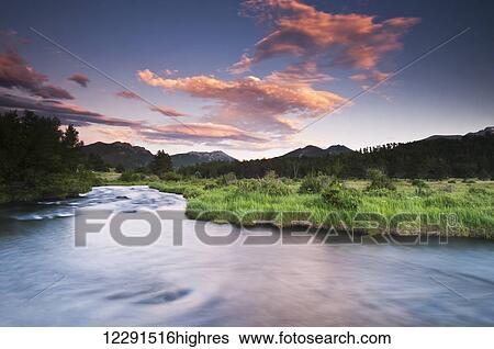 Stock Photograph - Evening colors in meadow stream, Rocky Mountain National Park; Colorado, United States of America. Fotosearch