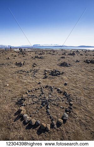 Stock Photograph - Exploring the tectonic plates and rock figures in Thingvellir National Park; Thingvellir, Iceland. Fotosearch