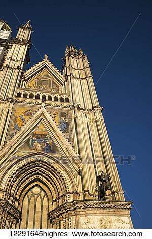 Stock Photograph - Facade of Orvieto Cathedral; Orvieto, Umbria, Italy. Fotosearch