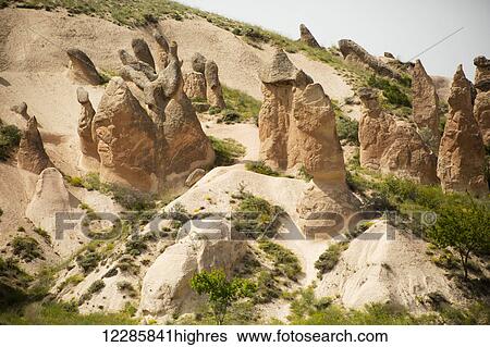 Fairy chimneys in Dervent Valley, also known as Imagination Valley; Cappadocia, Turkey View Large Photo Image Stock Photograph - Fairy chimneys in Dervent Valley, also known as Imagination Valley; Cappadocia, Turkey. Fotosearch