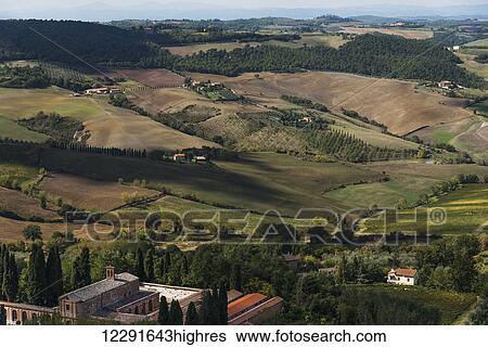 Stock Photograph - Farmland on rolling hills; Montepulciano, Toscana, Italy. Fotosearch