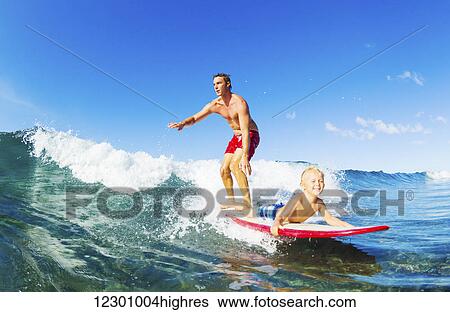 Father and Son Surfing Together View Large Photo Image Stock Photograph - Father and Son Surfing Together. Fotosearch