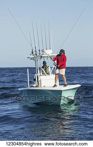 Fishing from a boat on the Atlantic ocean; Cape Cod, Massachusetts, United States of America View Large Photo Image Stock Photograph - Fishing from a boat on the Atlantic ocean; Cape Cod, Massachusetts, United States of America. Fotosearch