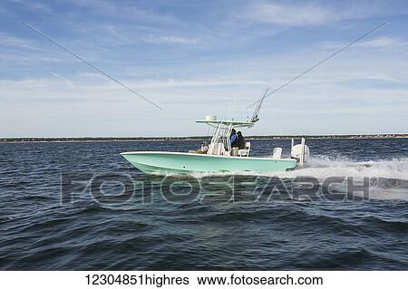 Fishing from a motorboat off the Atlantic coast; Cape Cod, Massachusetts, United States of America View Large Photo Image Stock Photograph - Fishing from a motorboat off the Atlantic coast; Cape Cod, Massachusetts, United States of America. Fotosearch