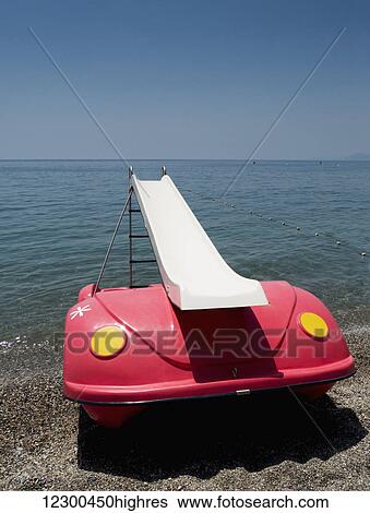 Stock Photograph - Floating slide on the beach, Almunecar beach; Andalusia, Spain. Fotosearch