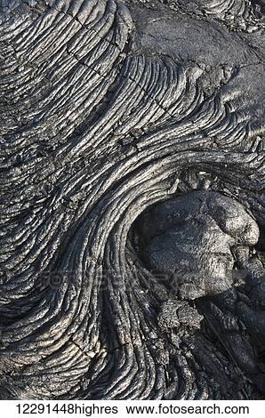 Stock Photograph - Folds of cooled lava in Hawaii Volcanoes National Park; Island of Hawaii, Hawaii, United States of America. Fotosearch