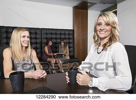 Four professional business women meeting in a boardroom; St. Albert, Alberta, Canada View Large Photo Image Stock Image - Four professional business women meeting in a boardroom; St. Albert, Alberta, Canada. Fotosearch