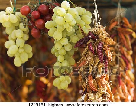Fresh and dried fruit hanging; Positano, Campania, Italy View Large Photo Image Stock Photograph - Fresh and dried fruit hanging; Positano, Campania, Italy. Fotosearch