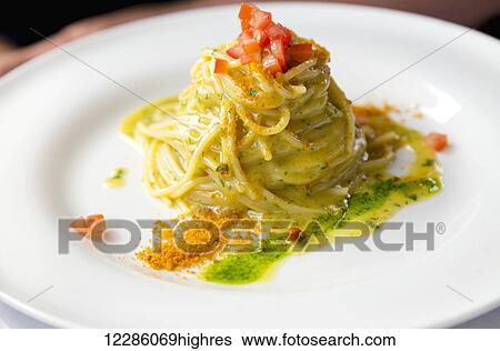 Fresh authentic Italian pasta with lemon butter sauce nicely plated for dinner at a restaurant in Italy; Bellagio, Lombardy, Italy View Large Photo Image Stock Photograph - Fresh authentic Italian pasta with lemon butter sauce nicely plated for dinner at a restaurant in Italy; Bellagio, Lombardy, Italy. Fotosearch