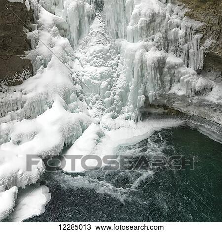 Stock Image - Frozen waterfall in Johnston Canyon, Banff National Park; Alberta, Canada. Fotosearch