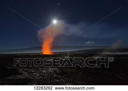 Stock Image - Full moon over Halemaumau Crater within the much larger summit caldera of Kilauea in Hawaii Volcanoes National Park, steaming vents in foreground, Mauna Loa mountain in background; Island of Hawaii, Hawaii, United States of America. Fotosearch
