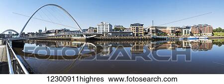 Stock Photograph - Gateshead Millenium Bridge; Gateshead, Tyne and Wear, England. Fotosearch